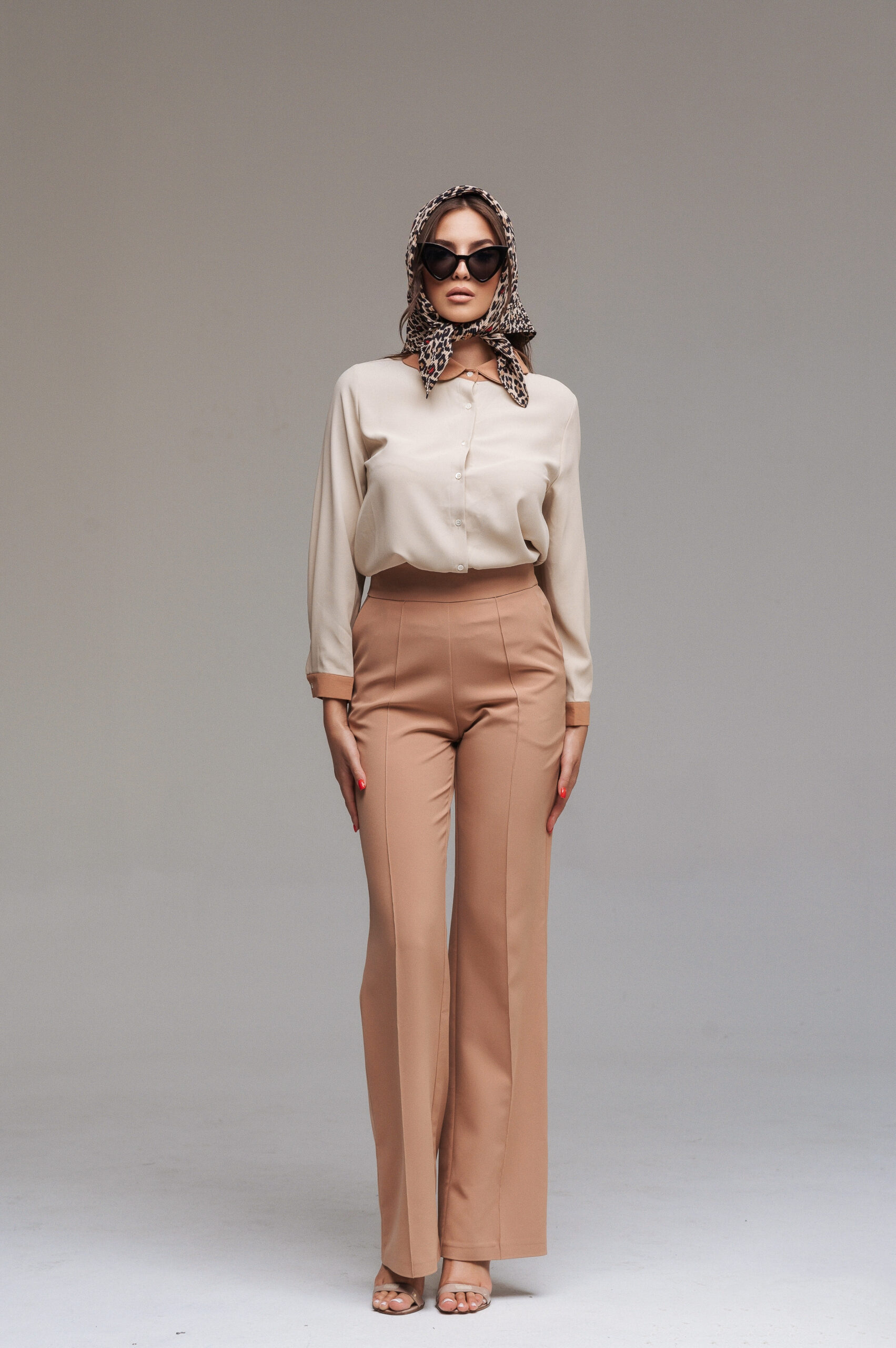 Blouse with an oval collar and narrow cuffs in the same color
